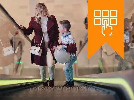 woman and child on an escalator