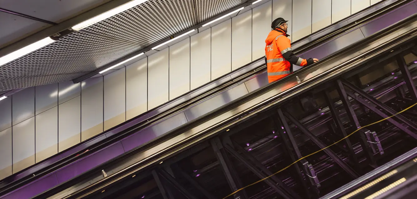 Person on an escalator in Vienna metro