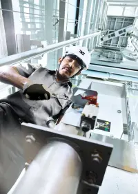 Our experienced service technician taking care of an elevator.