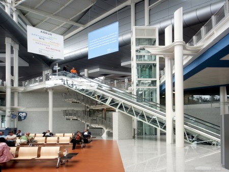 A modern indoor escalator at the airport.