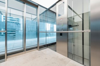 The interior of a modernized elevator with glass walls