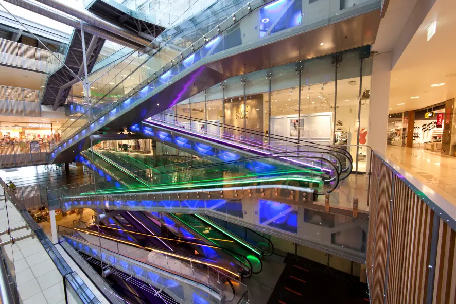Inclined moving walkway lightened with various colors