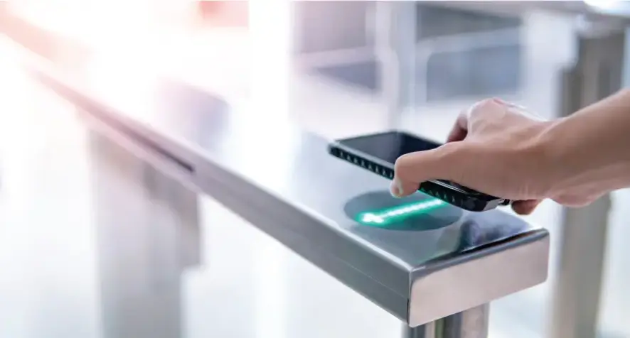 A photo of a mobile device tapping an NFC sensor