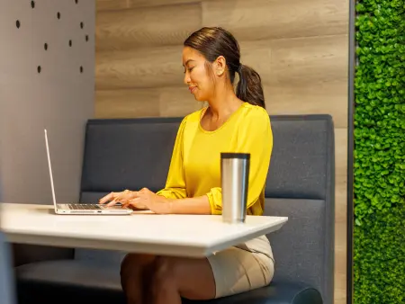 A property manager using her laptop to reach out for support.