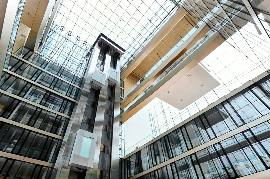 A photo of TK Elevator elevators from below.