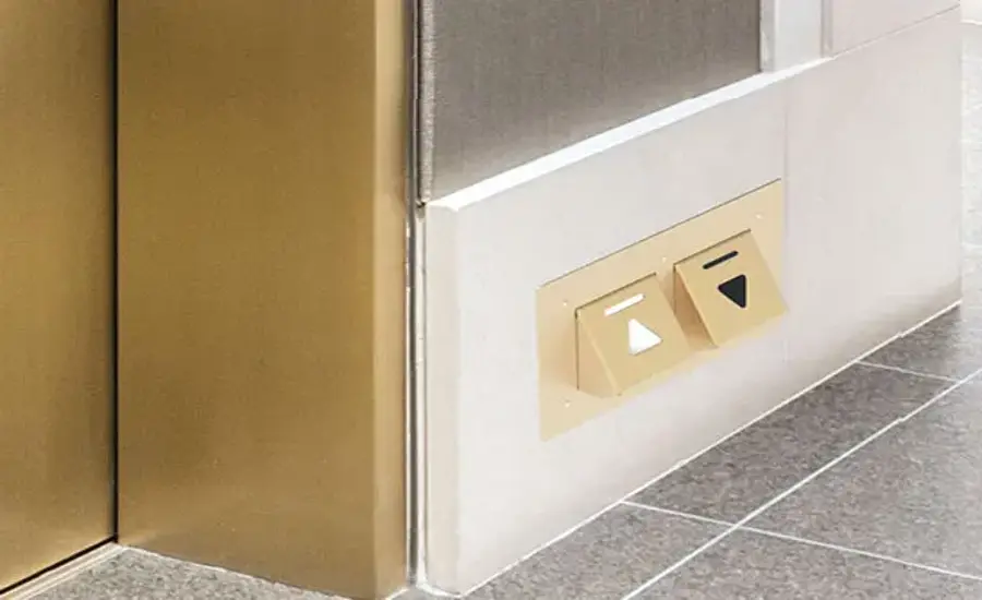 
A pair of Toe-To-Go (T2G) foot-activated elevator call buttons with the up button illuminated.
