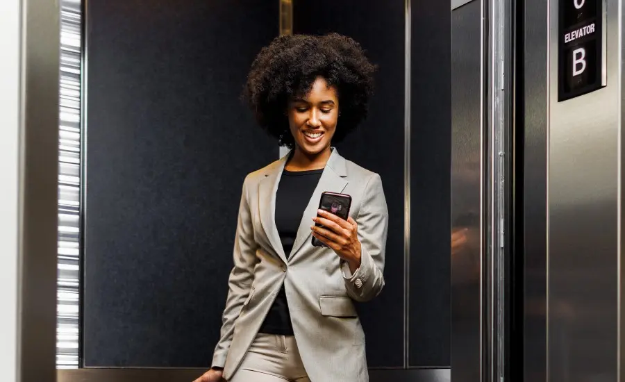 
Elevator passenger uses the AGILE Mobile app on her phone.
